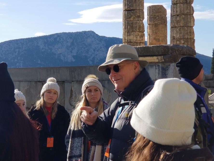 Professor Bruce Hitchner gives a lecture in front of Greek ruins