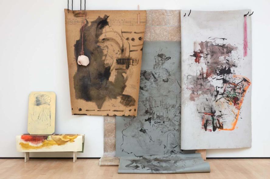 An artwork made from ink, clay, wood, linoleum, dye, felt and paint.