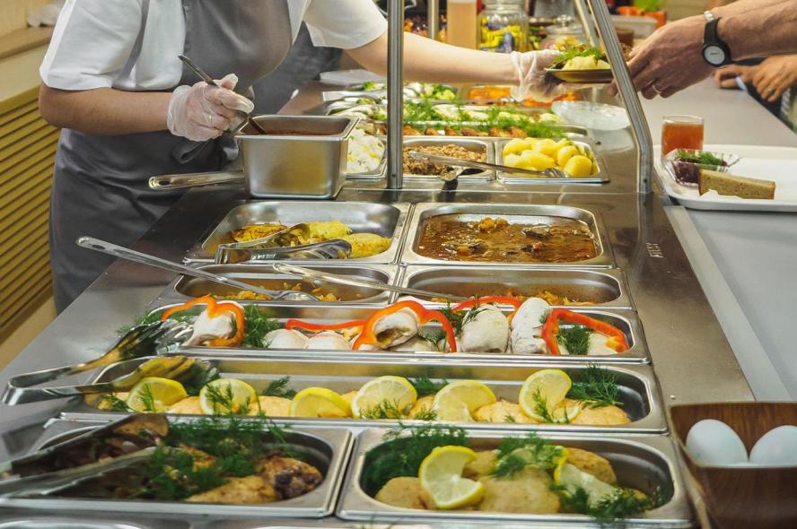 If Office Cafeterias Comply with U.S. Nutrition Standards, It Could Save Millions in Health Care Spending A workplace cafeteria counter with fresh, nutritious food options