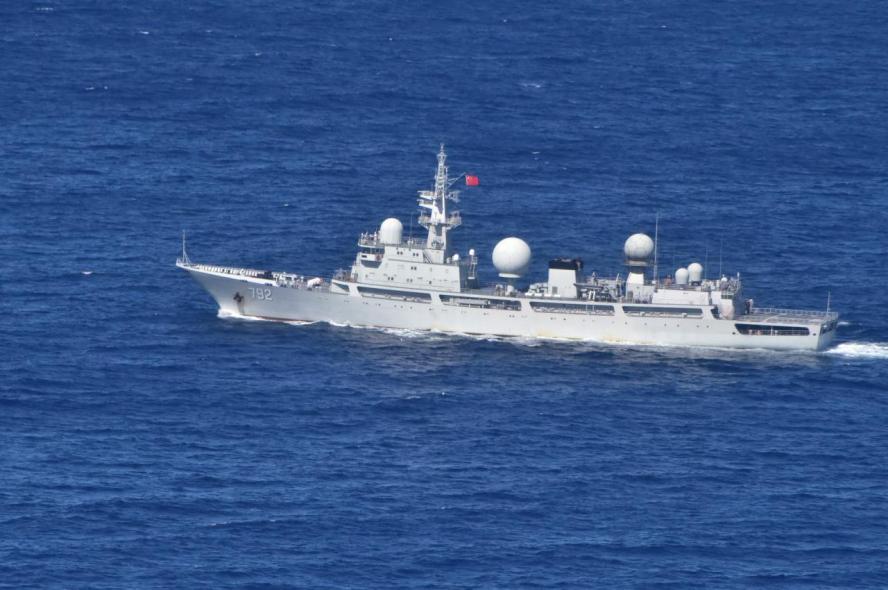 A large ship with Chinese red flag with large antenna towers in the open sea. The U.S. is entering a period where competition with an aggressive Beijing becomes especially risky, says Tufts political scientist in new book 