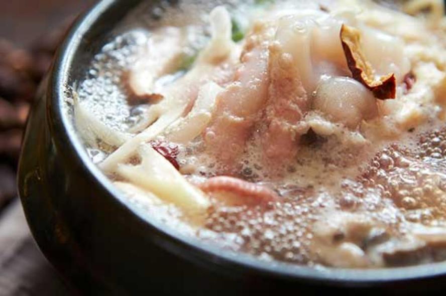 Boiling soup in a pot