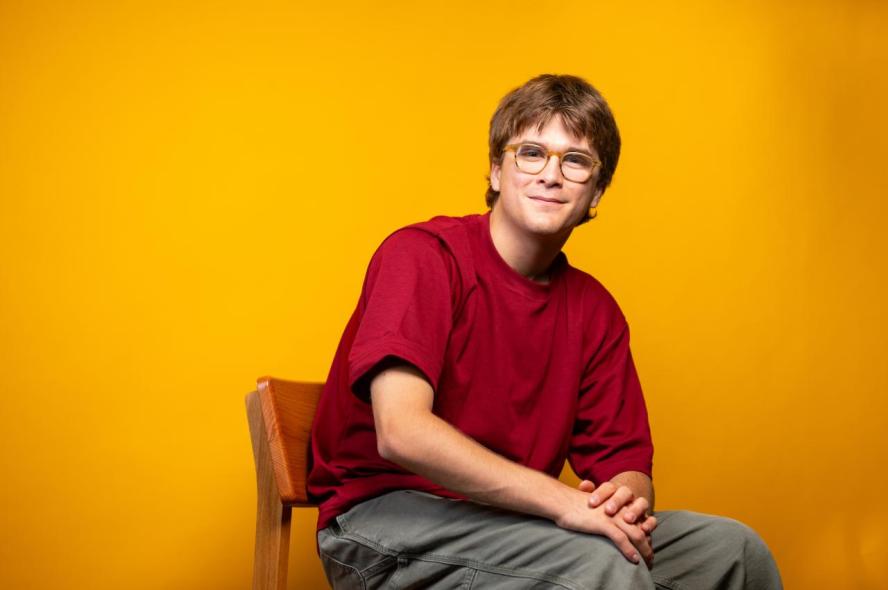 A man sitting in a chair smiling