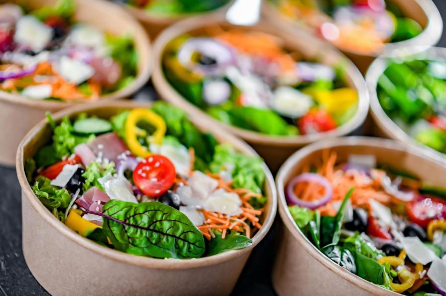 Medically Tailored Meal Programs Could Yield Significant Health Care Savings Across 49 U.S. States Bowls of colorful salads being prepared