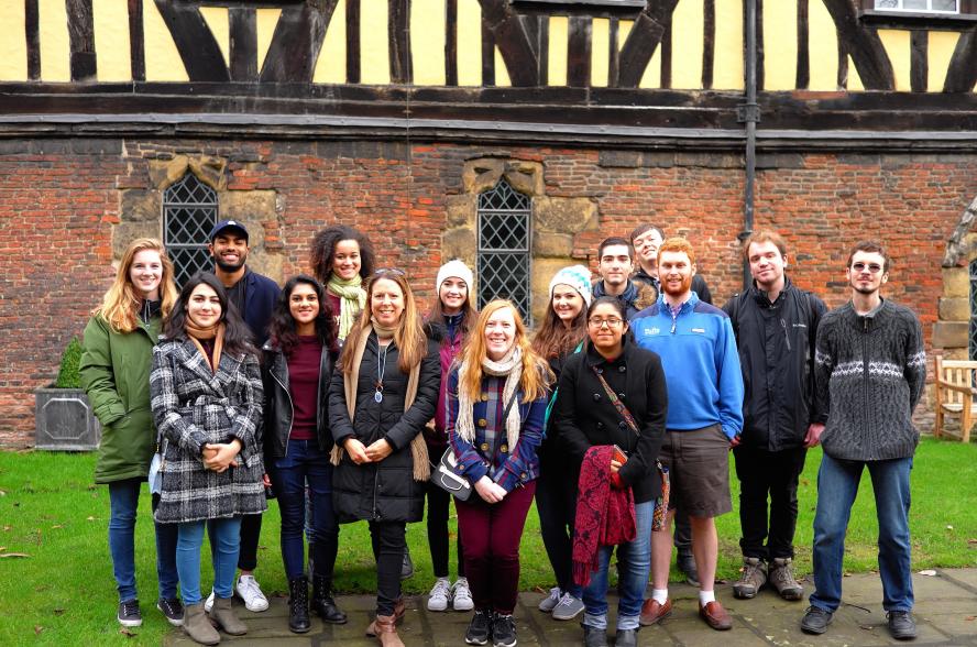 Tufts study abroad students posing in front of a traditional building in York, England