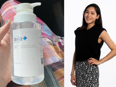 A bottle of hand sanitizer and Tufts graduate student Earn Khunpinit