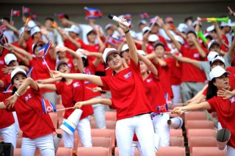 North Korean cheerleaders perform in China