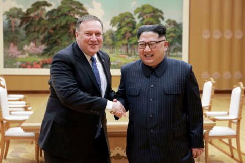 Mike Pompeo shakes hands with Kim Jong-Un in North Korea