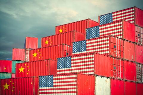 cargo containers with the flags of the U.S. and China stacked up for shipment