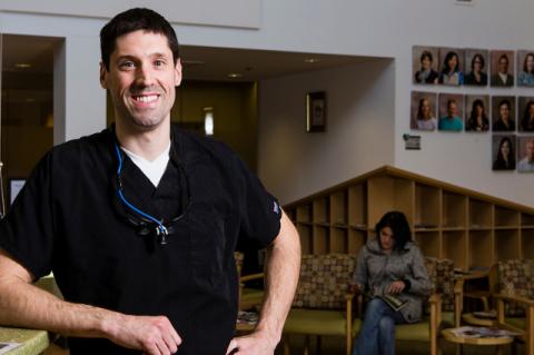 Help for Those Helping Others Gregory Fredette at the front desk of a dental clinic
