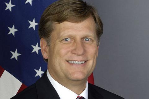 Michael McFaul in front of the U.S. flag