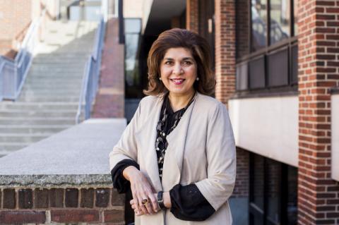 Farah Pandith standing outside The Fletcher School. The former State Department Special Representative to Muslim Communities, Pandith talks about her new book “How We Win” in a Tufts podcast