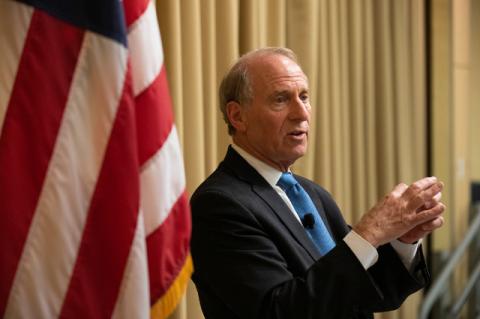 A man speaking into a microphone. Richard Haass, president of the Council on Foreign Relations, tells a Tufts audience that what happens in the world fundamentally affects life in the United States