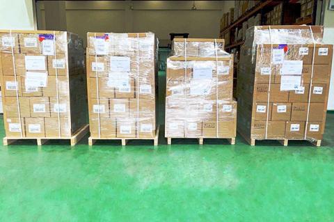 Pallets of shipping boxes waiting at a warehouse. Tufts parents in China donated 31,000 N95 masks and other precious equipment to Tufts Medical Center. 