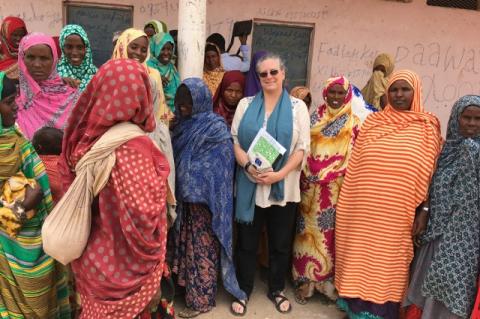The Veterinarian-Humanitarian Christine Jost with a number of Somali women. A Cummings School and Fletcher School alum, Jost works to get U.S. aid where it’s needed to fight COVID-19, locusts, and other emergencies across the globe