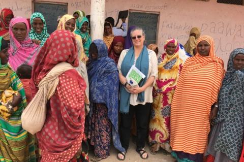 Christine Jost with a number of Somali women. A Cummings School and Fletcher School alum, Jost works to get U.S. aid where it’s needed to fight COVID-19, locusts, and other emergencies across the globe 