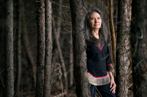 Portrait of Dalee Sambo Dorough, chair of the Inuit Circumpolar Council, in the woods