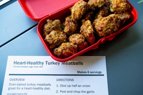 meatballs in a red container with a printed recipe