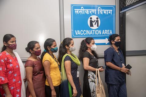 A Problem That Stands Between Us and the End of the Pandemic Police and health care workers line up to register for the COVID-19 vaccine at a hospital in Mumbai, India. Vaccine nationalism threatens to delay the end of the pandemic.