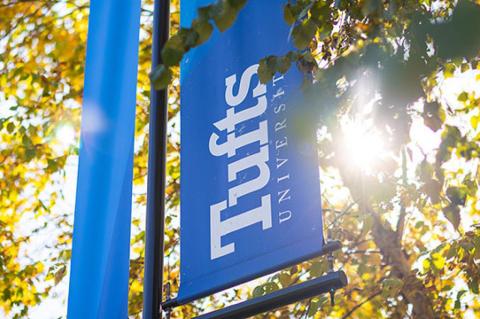 a stock photo of signage identifying Tufts University