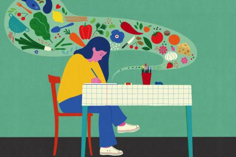 A woman sits at a table, writing, while a thought bubble comes from her writing that includes images of various food items.