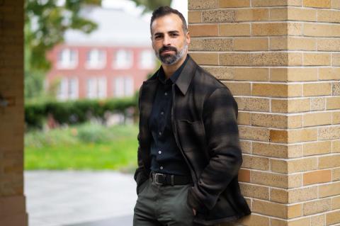 Brandon McDonald standing outside on the Tufts University campus