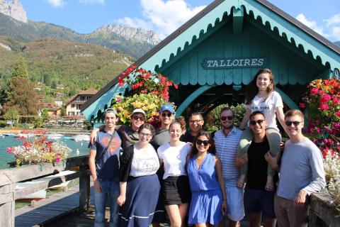 students standing in front of a covered bridge in Talloires