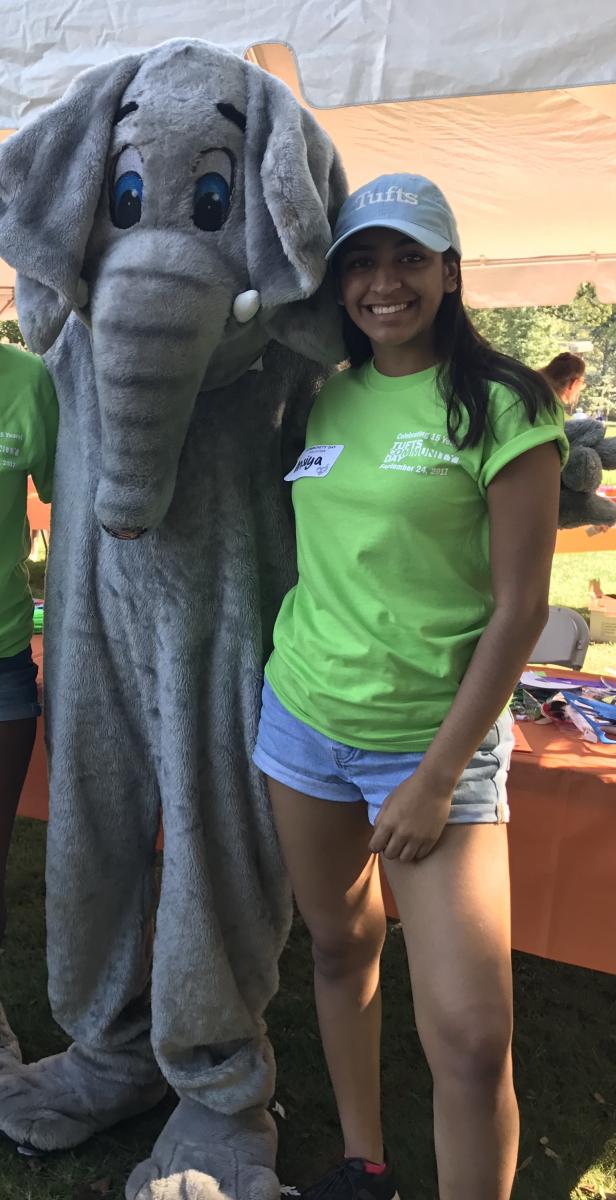 Insiya Naim, winner of the 2021 Chapman Award, posing with Jumbo