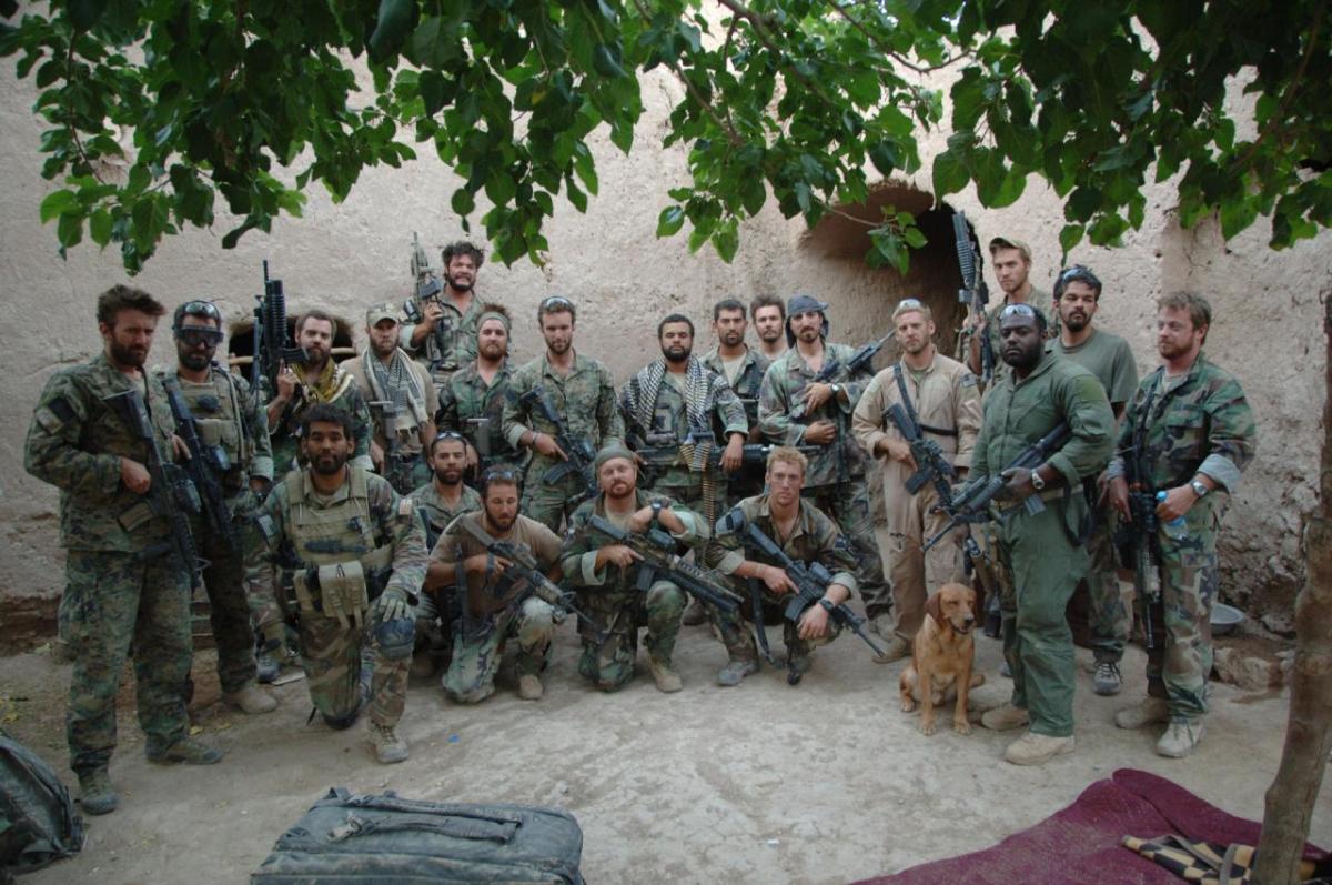 To Leave No One Behind in Afghanistan A large group of U.S. Marines with heavy weaponry standing in a dusty courtyard in Afghanistan in 2008. In a new book, writer and former Marine Elliot Ackerman, a Tufts alum, describes America’s chaotic departure from Afghanistan, and his own lessons
